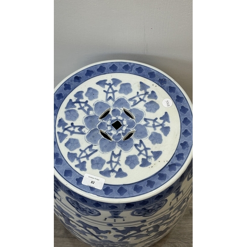 82 - A Chinese blue and white ceramic garden stool - approx. 45cm high x 30cm diameter