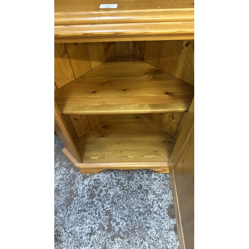 84 - A pine free standing corner display cabinet - approx. 191cm high x 71cm wide x 44cm deep