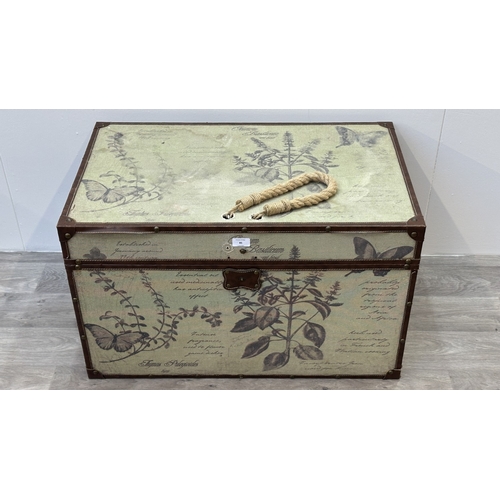 85 - A modern botanical themed fabric and brown faux leather storage chest with later rope handle to top ... 