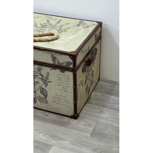 85 - A modern botanical themed fabric and brown faux leather storage chest with later rope handle to top ... 