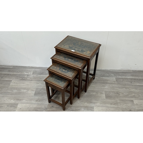 87 - A Chinese carved hardwood quartetto nest of tables - approx. 63cm high x 50cm wide x 35cm deep