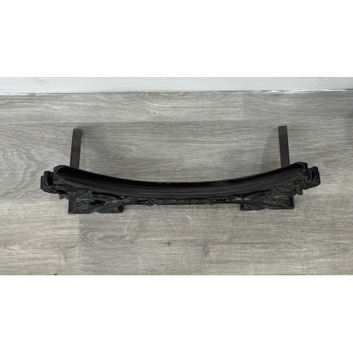 89 - A Chinese celadon glazed ceramic charger with dragon motif on carved wooden stand - approx. 50cm dia... 