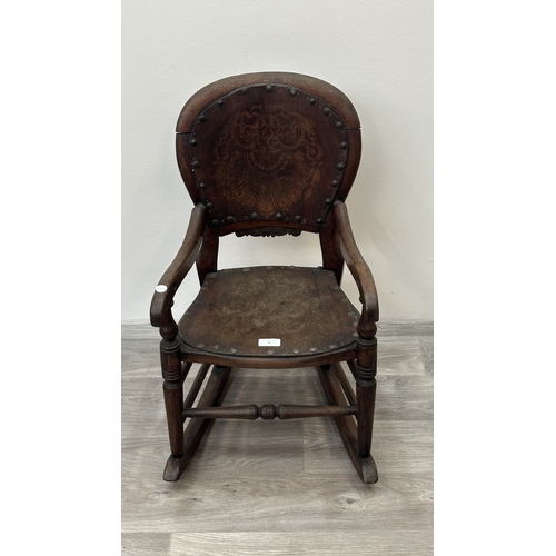 9 - A late 19th century stained beech and embossed plywood child's rocking chair - approx. 65cm high x 3... 