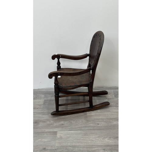 9 - A late 19th century stained beech and embossed plywood child's rocking chair - approx. 65cm high x 3... 