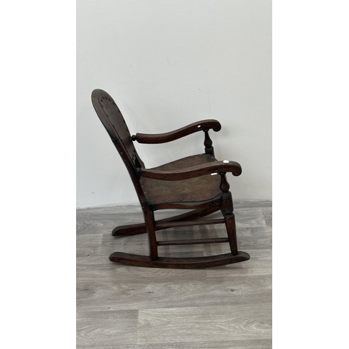 9 - A late 19th century stained beech and embossed plywood child's rocking chair - approx. 65cm high x 3... 