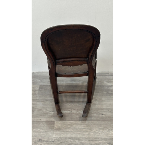 9 - A late 19th century stained beech and embossed plywood child's rocking chair - approx. 65cm high x 3... 