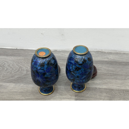 91 - A pair of Chinese cloisonné baluster vases on wooden stands - approx. 17.5cm high