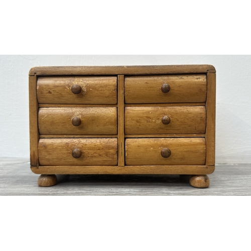 93 - A 19th century style wooden miniature apprentice piece chest of drawers/jewellery cabinet - approx. ... 