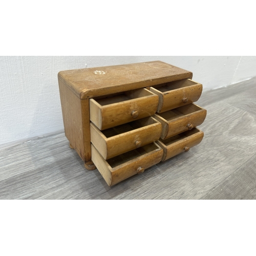 93 - A 19th century style wooden miniature apprentice piece chest of drawers/jewellery cabinet - approx. ... 