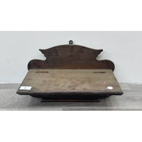 95 - A Georgian style stained oak wall hanging salt/candle box - approx. 21cm high x 37cm wide x 20cm dee... 