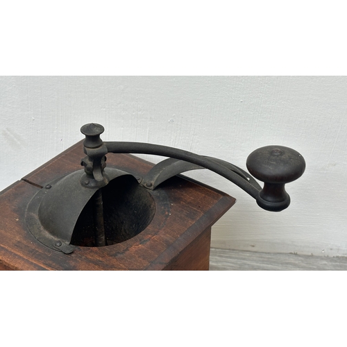 96 - An early 20th century French Peugeot Frères wood and metal coffee grinder - approx. 22cm high x 16cm... 