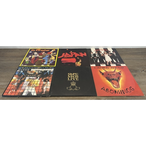 376 - Three boxes containing vinyl records to include Stiff Little Fingers, The Piranhas, Japan, Blondie, ... 