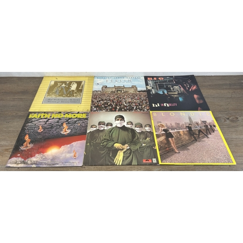 376 - Three boxes containing vinyl records to include Stiff Little Fingers, The Piranhas, Japan, Blondie, ... 