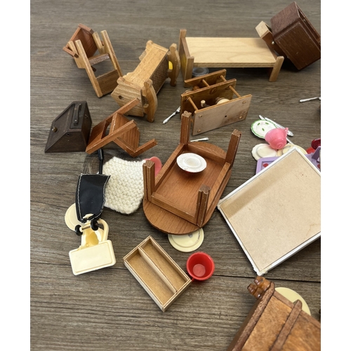 324 - Two bags containing mid/late 20th century doll's house furniture