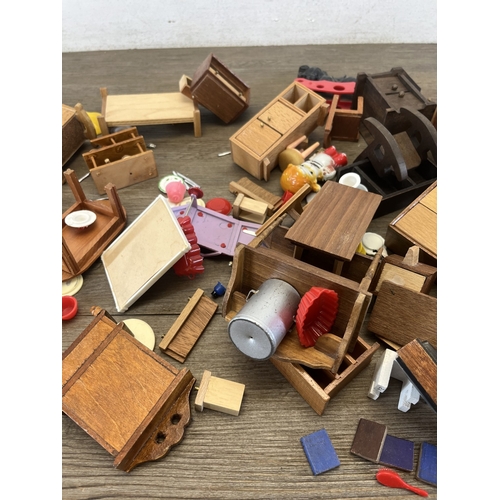 324 - Two bags containing mid/late 20th century doll's house furniture