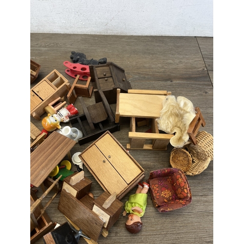 324 - Two bags containing mid/late 20th century doll's house furniture