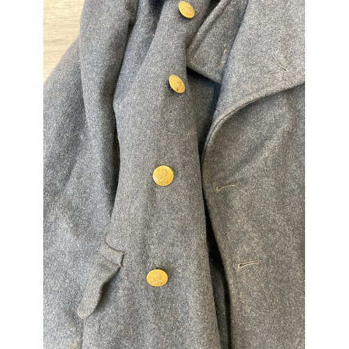 343 - Seven items to include cased WWII entrenching tool, WWII canvas gas mask bag containing pewter hip f... 