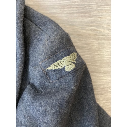 343 - Seven items to include cased WWII entrenching tool, WWII canvas gas mask bag containing pewter hip f... 