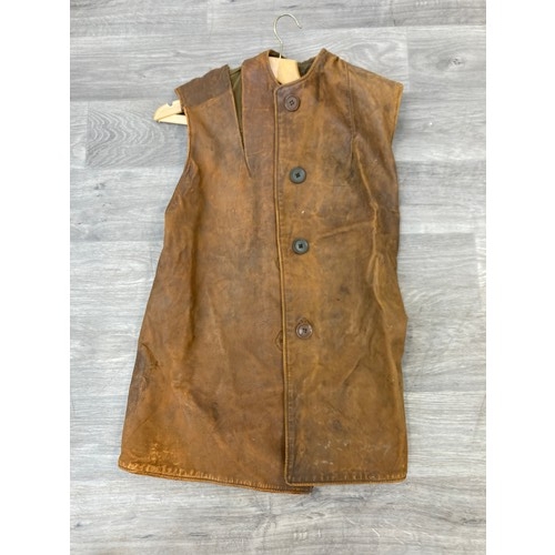 343 - Seven items to include cased WWII entrenching tool, WWII canvas gas mask bag containing pewter hip f... 