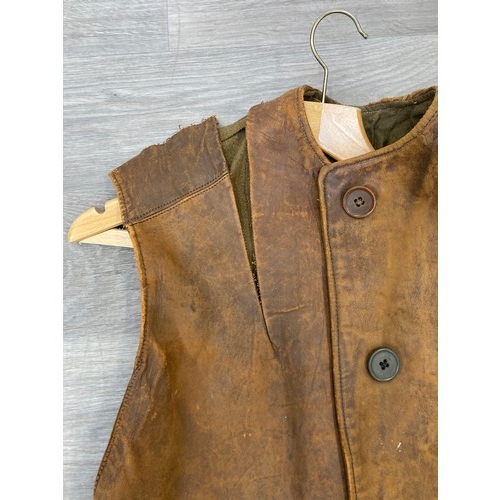 343 - Seven items to include cased WWII entrenching tool, WWII canvas gas mask bag containing pewter hip f... 