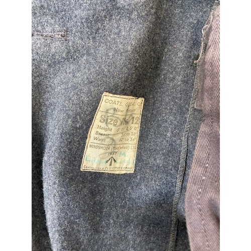 343 - Seven items to include cased WWII entrenching tool, WWII canvas gas mask bag containing pewter hip f... 