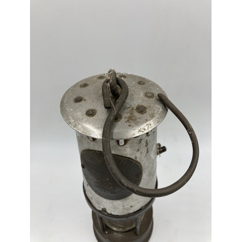 356 - A mid 20th century Protector Lamp & Lighting Co. Ltd. Type 6RS brass and steel miner's safety lamp, ... 