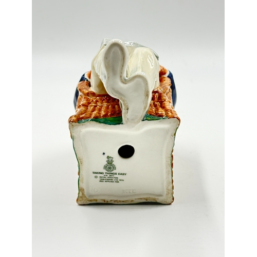 271 - A Royal Doulton Taking Things Easy figurine - HN2677
