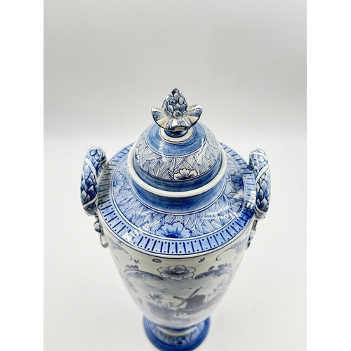 277 - A Franz Anton Mehlem (Royal Bonn 1890-1920) Delft hand painted blue and white porcelain twin handled... 