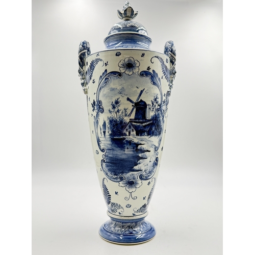 277 - A Franz Anton Mehlem (Royal Bonn 1890-1920) Delft hand painted blue and white porcelain twin handled... 