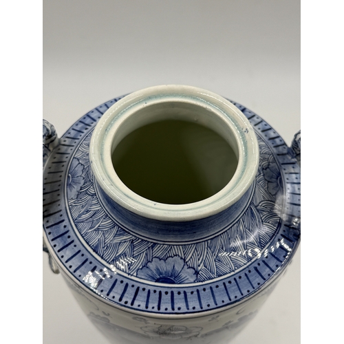 277 - A Franz Anton Mehlem (Royal Bonn 1890-1920) Delft hand painted blue and white porcelain twin handled... 