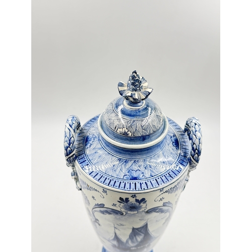 278 - A Franz Anton Mehlem (Royal Bonn 1890-1920) Delft hand painted blue and white porcelain twin handled... 