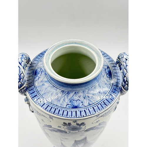 278 - A Franz Anton Mehlem (Royal Bonn 1890-1920) Delft hand painted blue and white porcelain twin handled... 