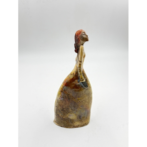 279 - A studio pottery figurine of an elongated women in the style of Marie-Madeleine Vitrolles, signed to... 