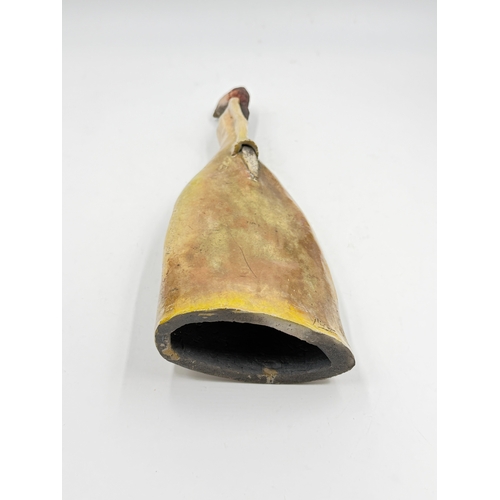 279 - A studio pottery figurine of an elongated women in the style of Marie-Madeleine Vitrolles, signed to... 