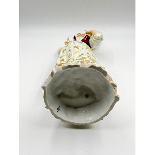 284 - A 19th century Volkstedt-Rudolstadt hand painted porcelain figurine of a lady, numbered 5227 to base... 