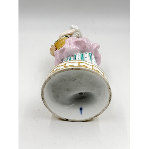 291 - A 19th century Charles Levy & Co. Paris France hand painted porcelain figurine of a lady with flower... 