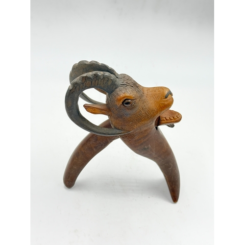 292 - An early 20th century German Black Forest carved wooden mountain goat nutcracker - approx. 21cm high