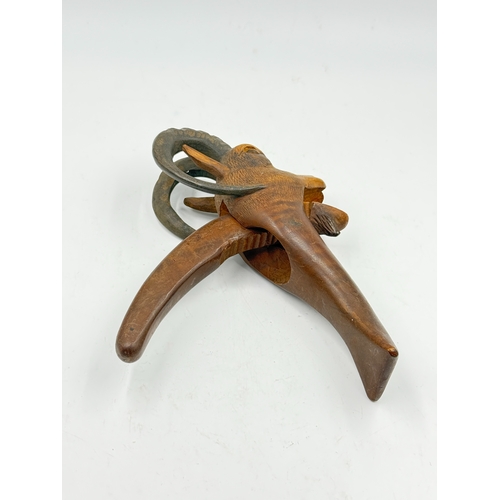 292 - An early 20th century German Black Forest carved wooden mountain goat nutcracker - approx. 21cm high