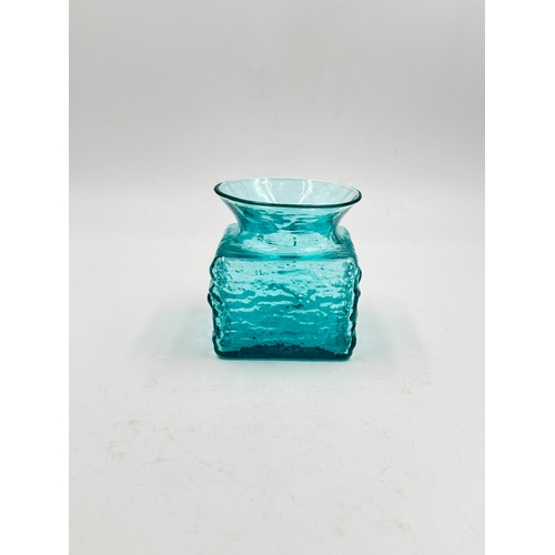 297 - Two pieces of mid 20th century glassware, one Dartington kingfisher blue textured bark vase by Frank... 