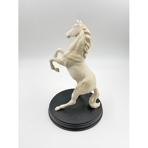 298 - A Royal Doulton 'Spirit of the Wild' matt white horse figurine on circular plinth - approx. 30cm hig... 