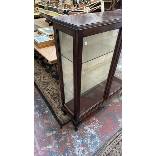 206 - An early 20th century mahogany display cabinet with two glass shelves - approx. 107cm high x 93cm wi... 