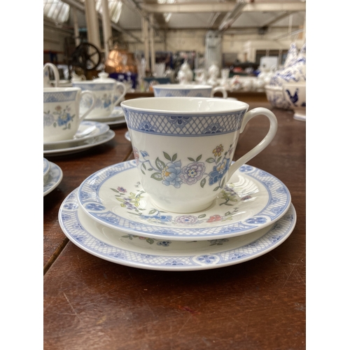 324 - Forty pieces of Royal Doulton Coniston fine bone china to include eleven teacups, saucers and side p... 