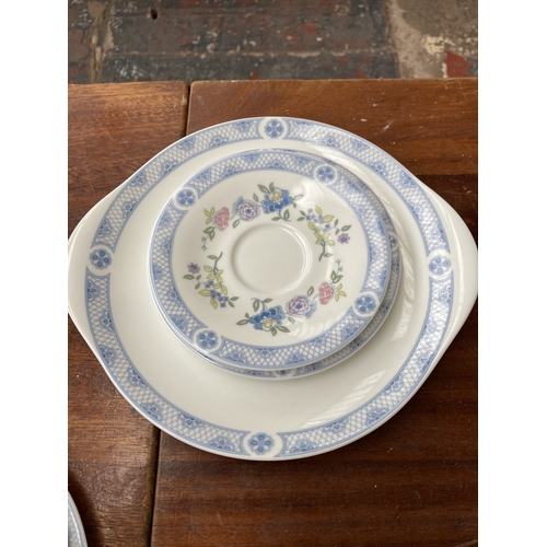 324 - Forty pieces of Royal Doulton Coniston fine bone china to include eleven teacups, saucers and side p... 