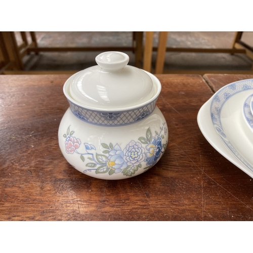 324 - Forty pieces of Royal Doulton Coniston fine bone china to include eleven teacups, saucers and side p... 