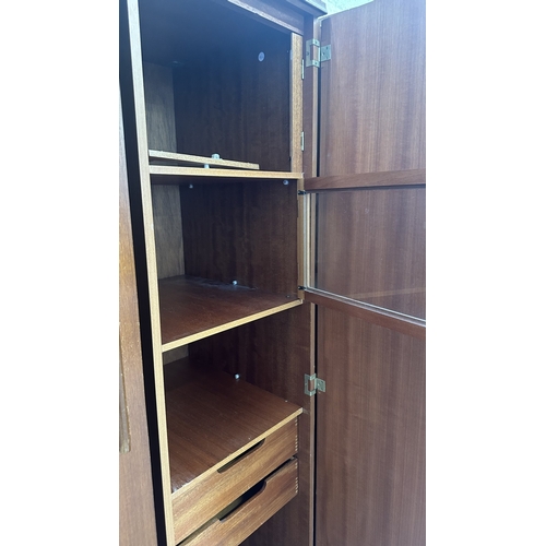 A mid 20th century Beautility teak double wardrobe with fitted interior ...