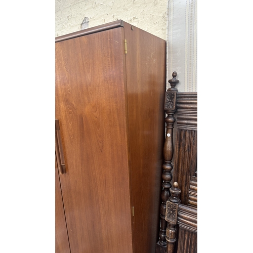 A mid 20th century Beautility teak double wardrobe with fitted mirror ...