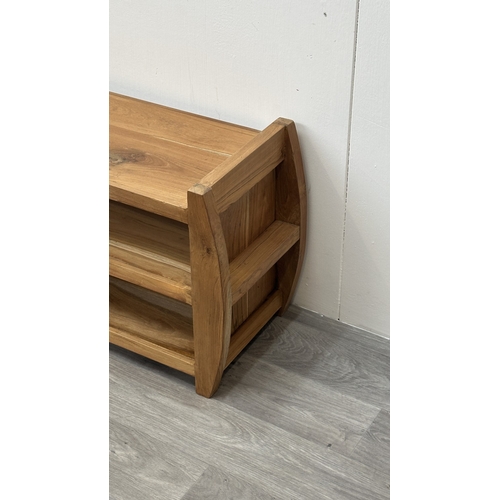 121 - An Indonesian suar wood TV stand - approx. 46cm high x 100cm wide x 32cm deep