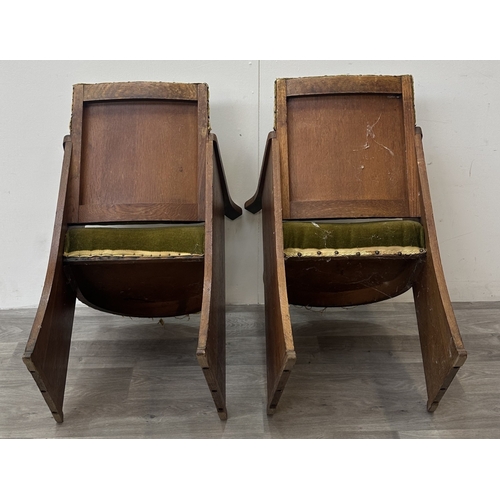 122 - A pair of Art Deco oak and green fabric upholstered armchairs with carved floral design, possibly by... 