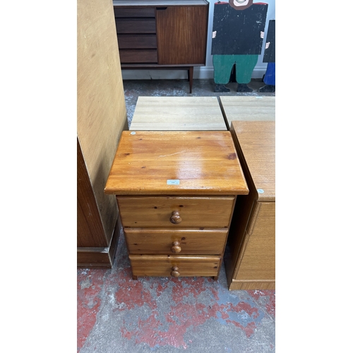 132 - Two bedside chests of drawers, one pine and teak effect - largest approx. 61cm high x 44.5cm wide x ... 