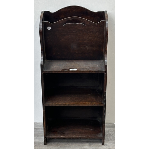 133 - An early 20th century oak three tier magazine rack bookcase - approx. 79cm high x 36cm wide x 20cm d... 